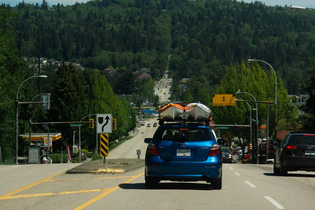 Loading a fishing kayak onto a car roof rack